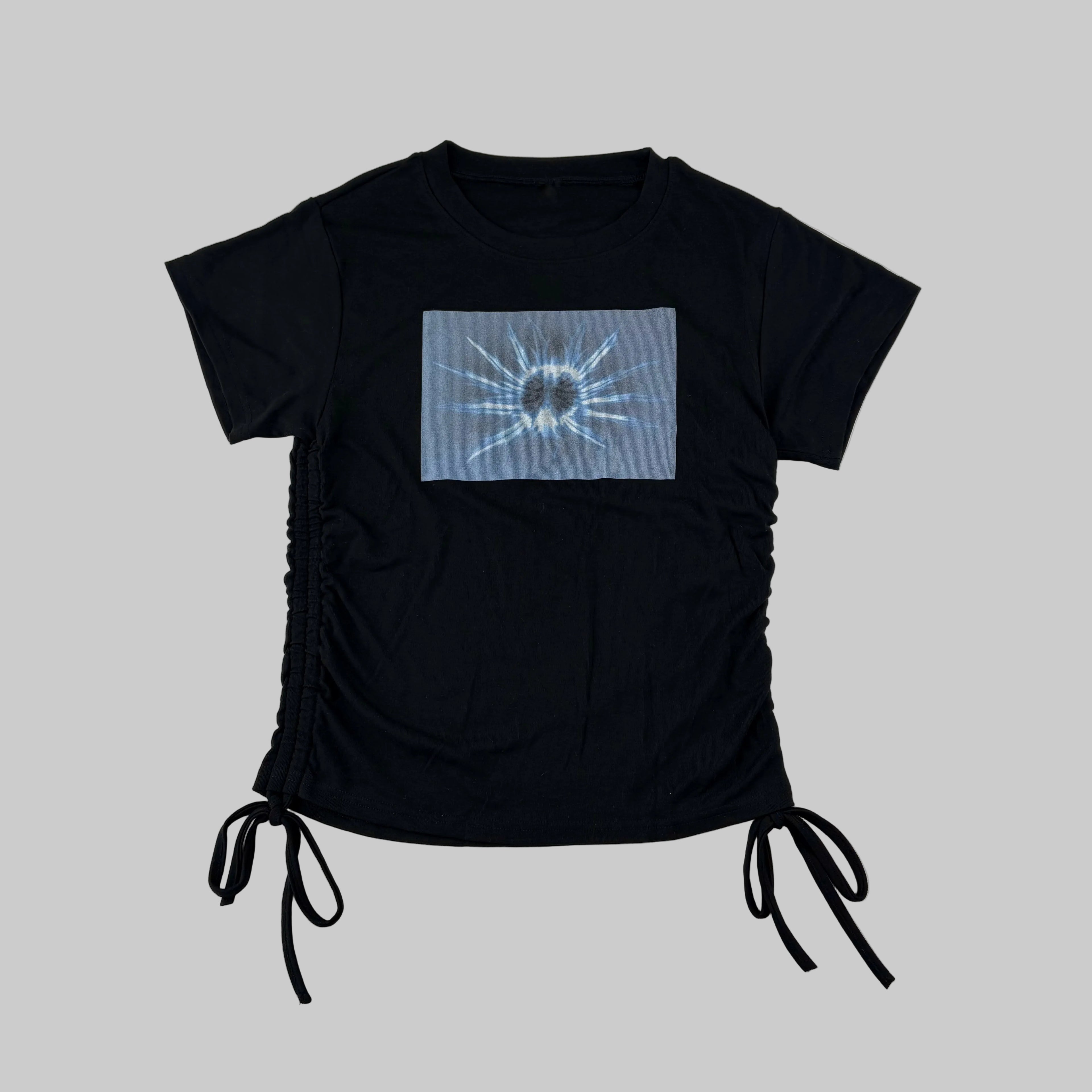 Black women's t-shirt with drawstring ties and Scottish thistle x-ray print in blue on the front made in Scotland