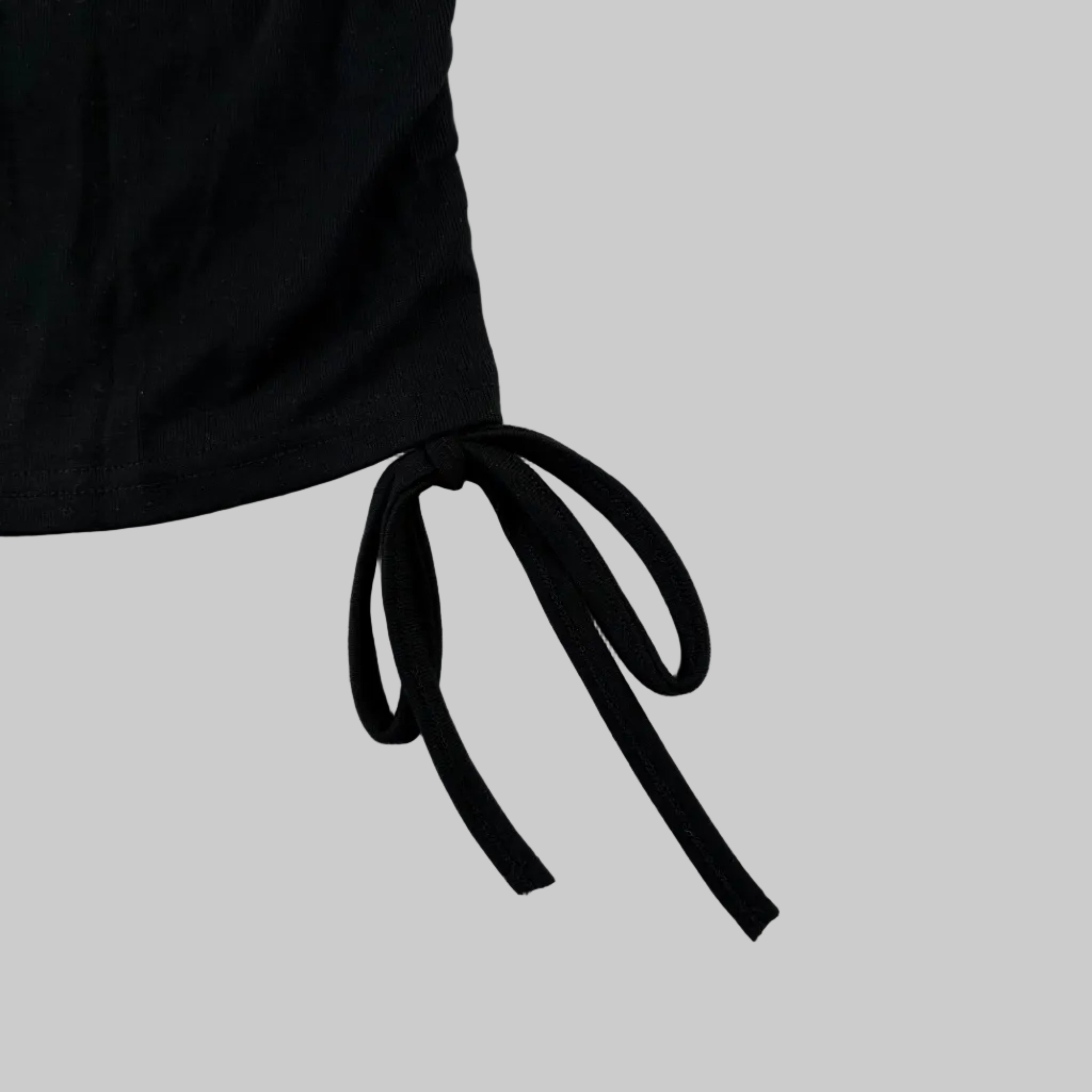 Black women's t-shirt with drawstring ties and Scottish thistle x-ray print in blue on the front made in Scotland